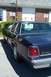 1991 Mercury Marquis - Rear view of a dark blue sedan, identified as a Crown Victoria, parked on asphalt.