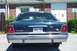 1991 Mercury Marquis - This dark blue sedan features a prominent chrome bumper and a New Hampshire license plate. The body style suggests a 1991 model year.