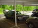 1991 Mercury Marquis - This 1991 Mercury Marquis is parked under a carport with other vehicles visible.