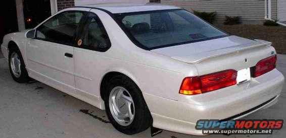 White 1994 Ford Thunderbird coupe parked on a driveway