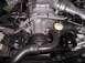 1994 Ford Thunderbird - Close-up view of an engine bay, showing various mechanical parts and wiring.