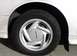 1994 Ford Thunderbird - Close-up of a 1994 Ford Thunderbird wheel, the iconic Thunderbird emblem on the hubcap.