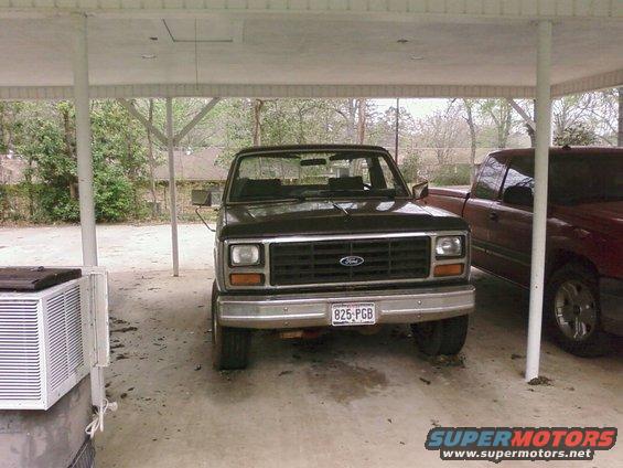 Black Ford truck front view with license plate 825-PGB