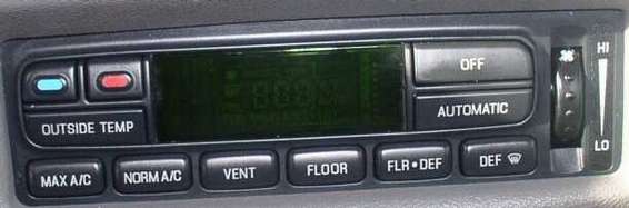 Car climate control panel with buttons for MAX A/C, NORM A/C, VENT, FLOOR, FLR DEF, DEF, OUTSIDE TEMP, OFF, AUTOMATIC, and a fan speed dial