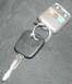 1999 Ford Crown Victoria - A Ford key with a remote fob attached rests on a dark, textured surface.