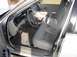 1999 Ford Crown Victoria - The interior of a 1998 Ford Crown Victoria is visible from the open passenger door.