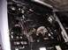 1999 Ford Crown Victoria - The engine bay of a vehicle, showing batteries and intricate mechanical components.