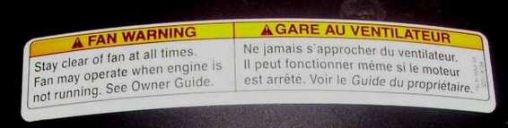 Fan warning label with English and French text