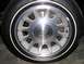 1999 Ford Crown Victoria - Close-up of a Ford wheel and tire assembly.