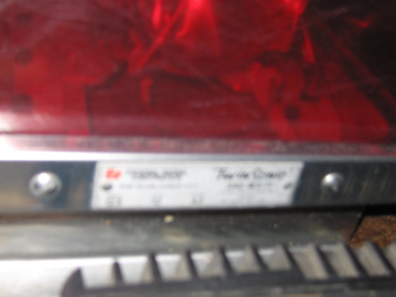 Label on a red light bar reads "Federal Signal" and "Ther-Mo-Guard"