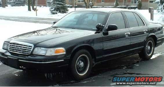 Black 1998 Ford Crown Victoria parked on a snowy street