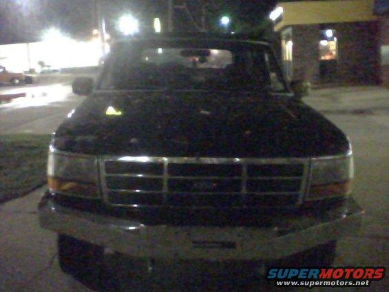Front view of a dark-colored Ford Bronco, likely from the early to mid-1990s