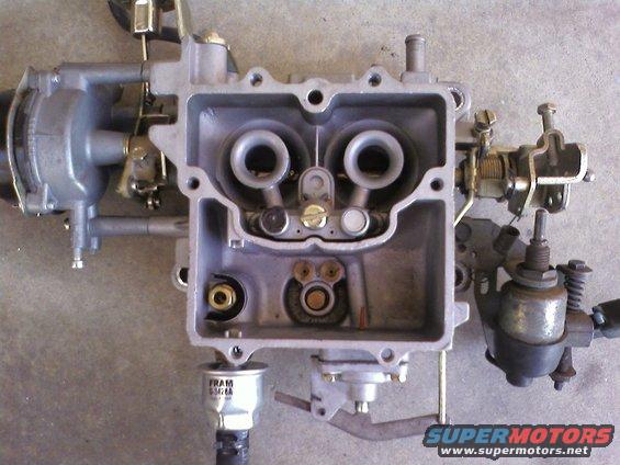 Holley carburetor with dual barrels and a FRAM filter attached