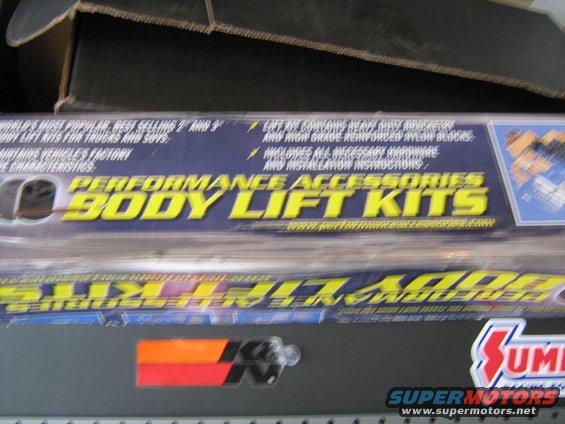 Boxes for performance body lift kits, one says 'Performance Accessories Body Lift Kits'
