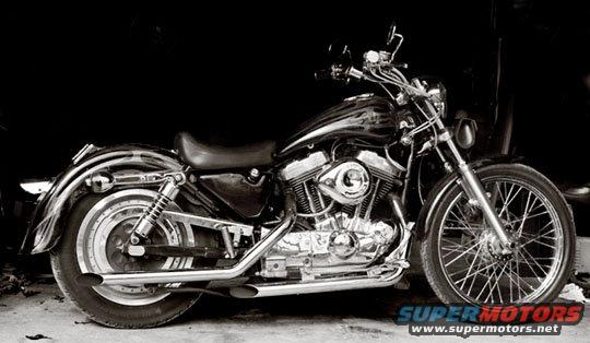 Side view of a black Harley-Davidson Sportster motorcycle with chrome accents