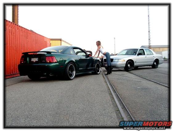 Silver 1998 Ford Crown Victoria parked on tracks