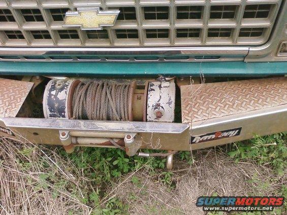 1977 Chevrolet truck front end with grille, Chevrolet bowtie emblem, and Ramsey winch mounted on diamond plate bumper