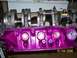 1995 Ford Bronco - A close-up view of a freshly painted purple engine block with a crankshaft assembly.