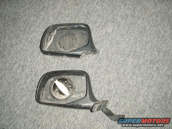 p3060002.jpg broken mirror housing with mirror motor removed. (top)
manual mirror housing from the junk yard. (bottom)

i managed to come close enough to a tree to snap the mirror clean off. (the plastic, even the metal interior rod)

i put my mirror motor into the new mirror housing i found at the junk yard.