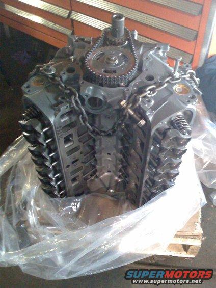 Engine block partially covered in plastic wrap
