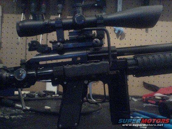 Sniper rifle with scope mounted on top