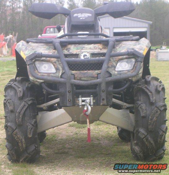 Camouflage ATV front view with large mud tires and winch