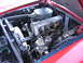 1973 Mercury Cougar - Close-up view of the engine compartment, highlighting the intricate mechanical components and the Mercedes-Benz branding.
