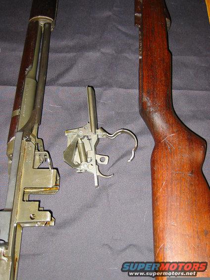 Disassembled firearm trigger group and stock