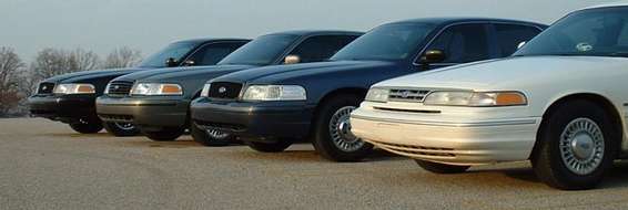 five police cars lined up, front view