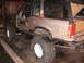 1979 Ford Bronco - This heavily modified SUV features oversized tires and a roll cage, suggesting it's built for off-road use.