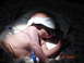 1981 Ford Bronco - Infant with eye mask and medical tubes in an incubator. Timestamp 8:08 PM.