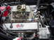 1964 Chevrolet Corvette - Close-up of a Chevrolet V8 engine, a carburetor and MSD ignition components.