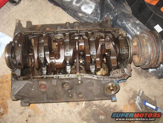 Oil pan and pump taken off. 
Pan had a massive dent in it, so its pitched.
