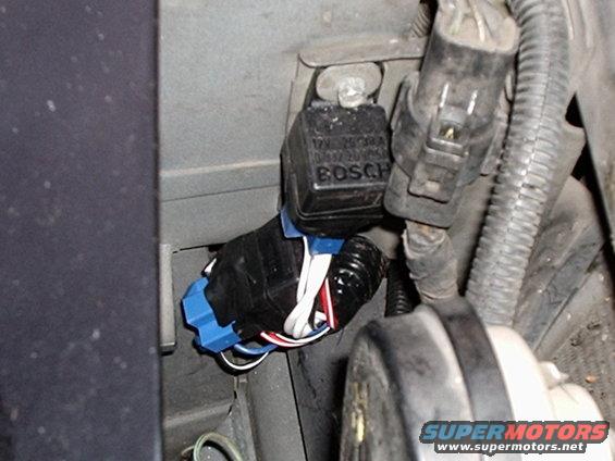 p1010009.jpg The relays mounted to the header panel bracket in front of the radiator and battery.