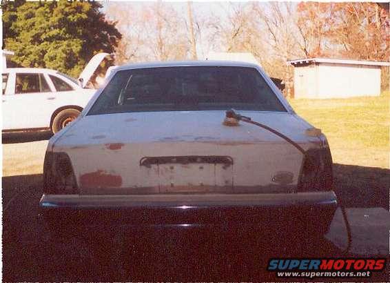 The back of the car last year when we just started sanding and filling the holes where the old "crown victoria" emblem was.