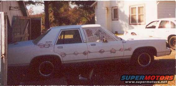 passengerside.jpg passenger's side last year when I started filling the holes where trim on the doors and the chrome bar for the vinyl top simulator was.