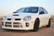1996 Ford Probe - Front 3/4 view of a white Dodge SRT-4 parked outdoors.