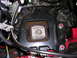 2007 Mazda 3 - Close-up of a vehicle's engine mount bracket and isolator assembly.