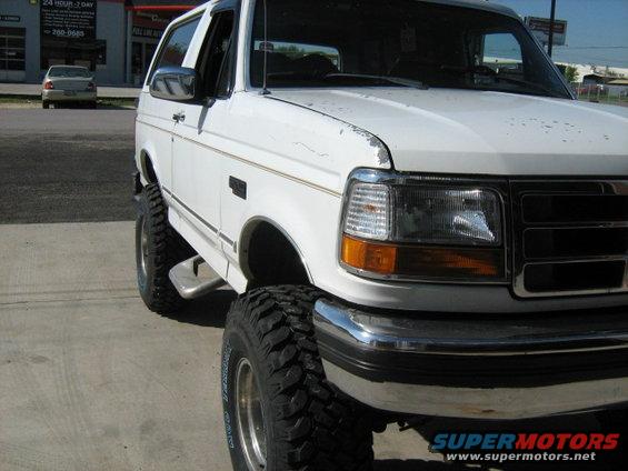 White 1993 Ford Bronco with lifted suspension and large tires