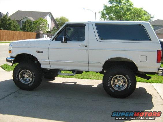White 1993 Ford Bronco side view with lifted suspension