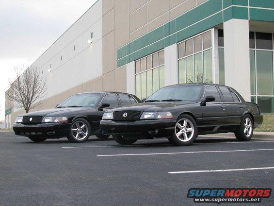 Two black 2003 Mercury Marauders parked in a lot