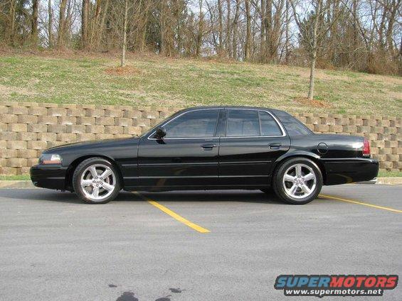Black 2003 Mercury Marauder parked on asphalt with yellow lines