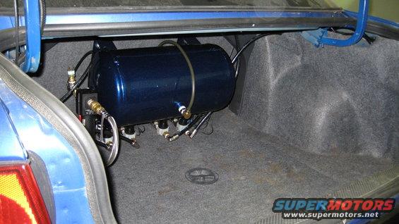 Trunk with a blue air tank and lines installed