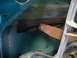 1996 Ford Bronco - Close-up of the internal door mechanism, likely for a window, showing aged and rusty components.