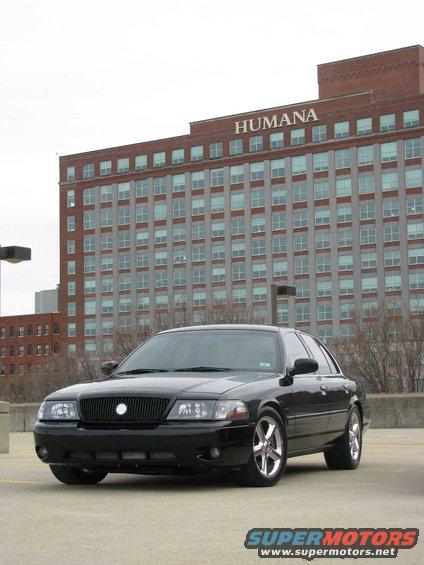 Black 2003 Mercury Marauder parked in front of a brick building with 'HUMANA' signage