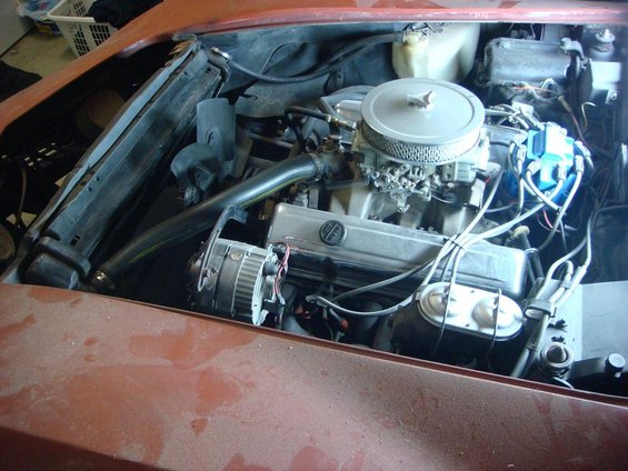 V8 engine bay of a vehicle with chrome air cleaner under restoration