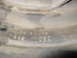 1964 Chevrolet Corvette - A close-up view of a stamped part reveals manufacturing details and origin.