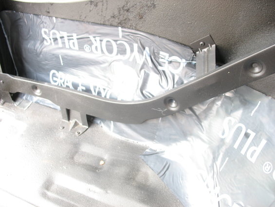 Interior view of waterproofing material with text 'GRACE VYCOR PLUS' under a dark gray trim piece
