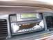 1995 Mercury Grand Marquis - Aftermarket stereo and digital gauge cluster installed in a vehicle's dashboard.
