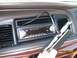 1995 Mercury Grand Marquis - The interior of a 1995 Mercury Grand Marquis shows a JVC stereo unit and wood grain trim on the dashboard.